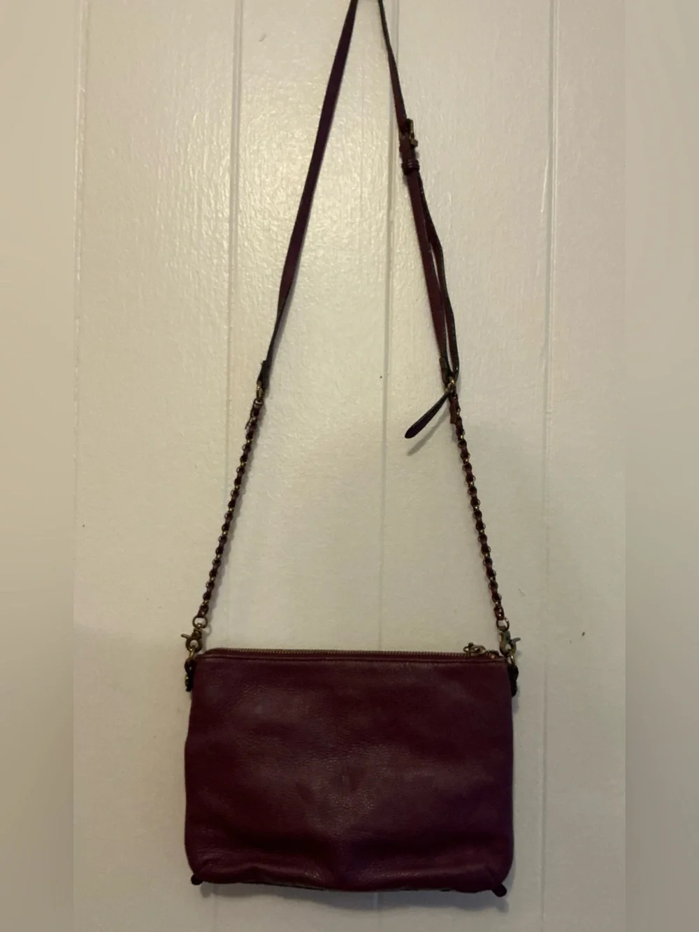 a Vintage Rare Elliott Lucca burgundy Leather laser-cut leather crossbody bag